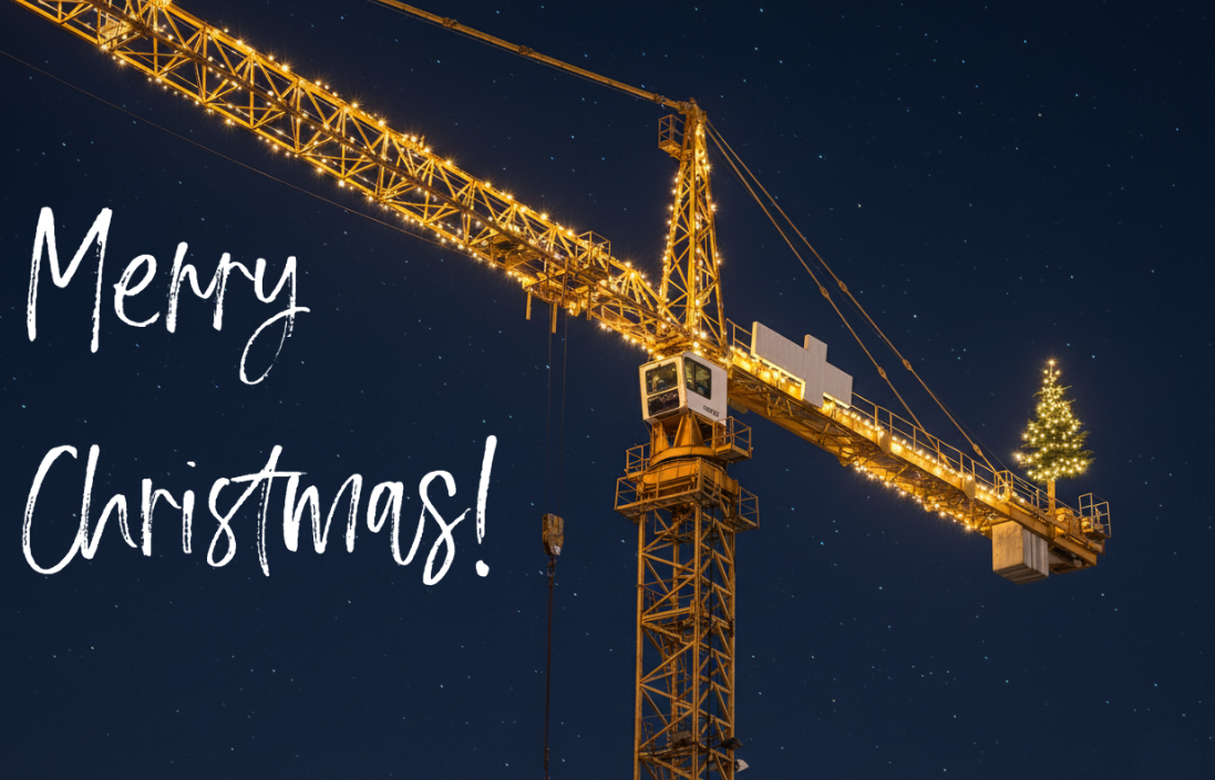 Escena nocturna de una gr&uacute;a iluminada. En el extremo posterior de la gr&uacute;a hay un &aacute;rbol de Navidad con iluminaci&oacute;n amarillo c&aacute;lido y en el lado izquierdo de la imagen aparece el texto &lsquo;Merry Christmas&rsquo; en letras blancas elegantes.