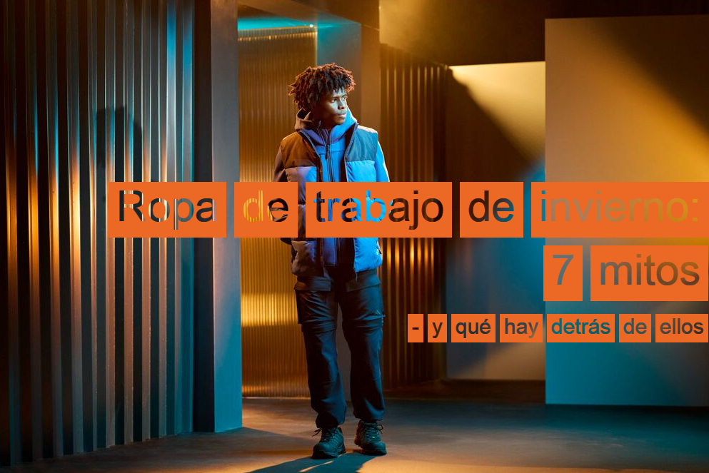 Un trabajador con ropa de trabajo azul y negra, en un espacio con varios pasillos. Las paredes son a rayas y se ve un juego de luces y sombras. En el lado derecho de la imagen aparece el t&iacute;tulo: Ropa de trabajo de invierno: 7 mitos &ndash; y qu&eacute; hay realmente detr&aacute;s